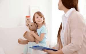 Child With Psychologist during Autism ADHD Assessment at home with no wait time